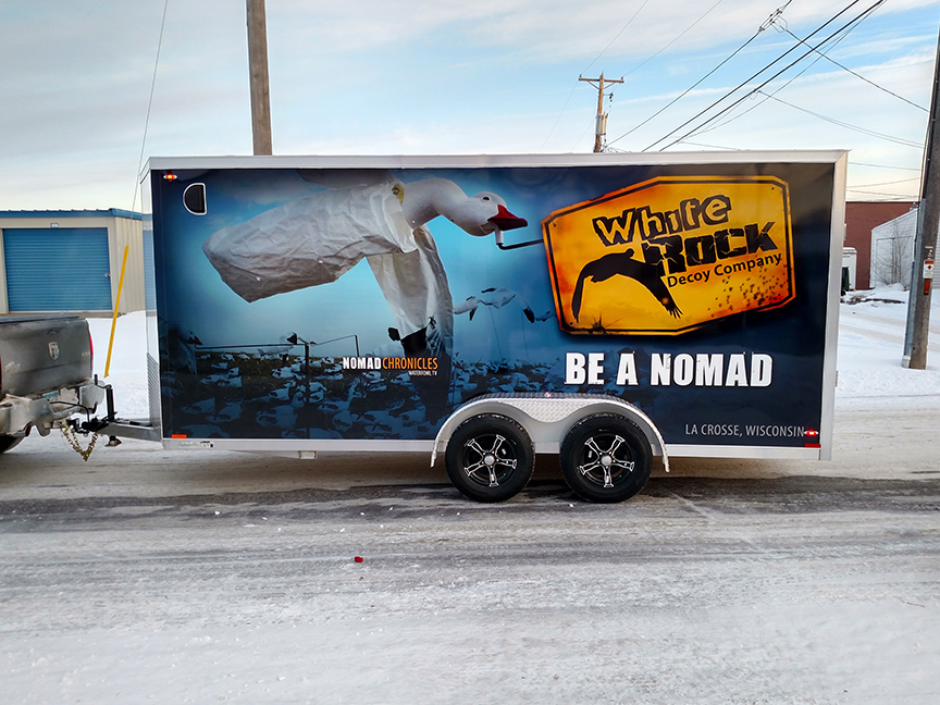 Wrap graphics on driver side of trailer for White Rock Decoy company