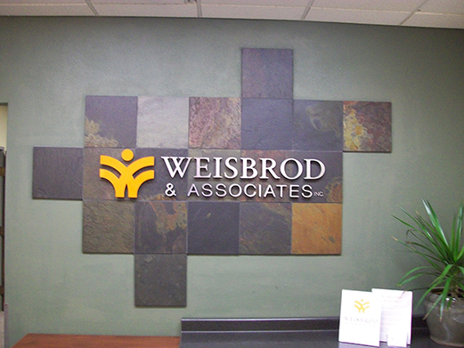Dimensional wall lettering for Weibrod & Associates office wall