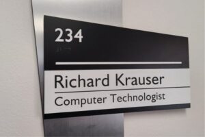 ADA compliant sign that was made for a computer technologist